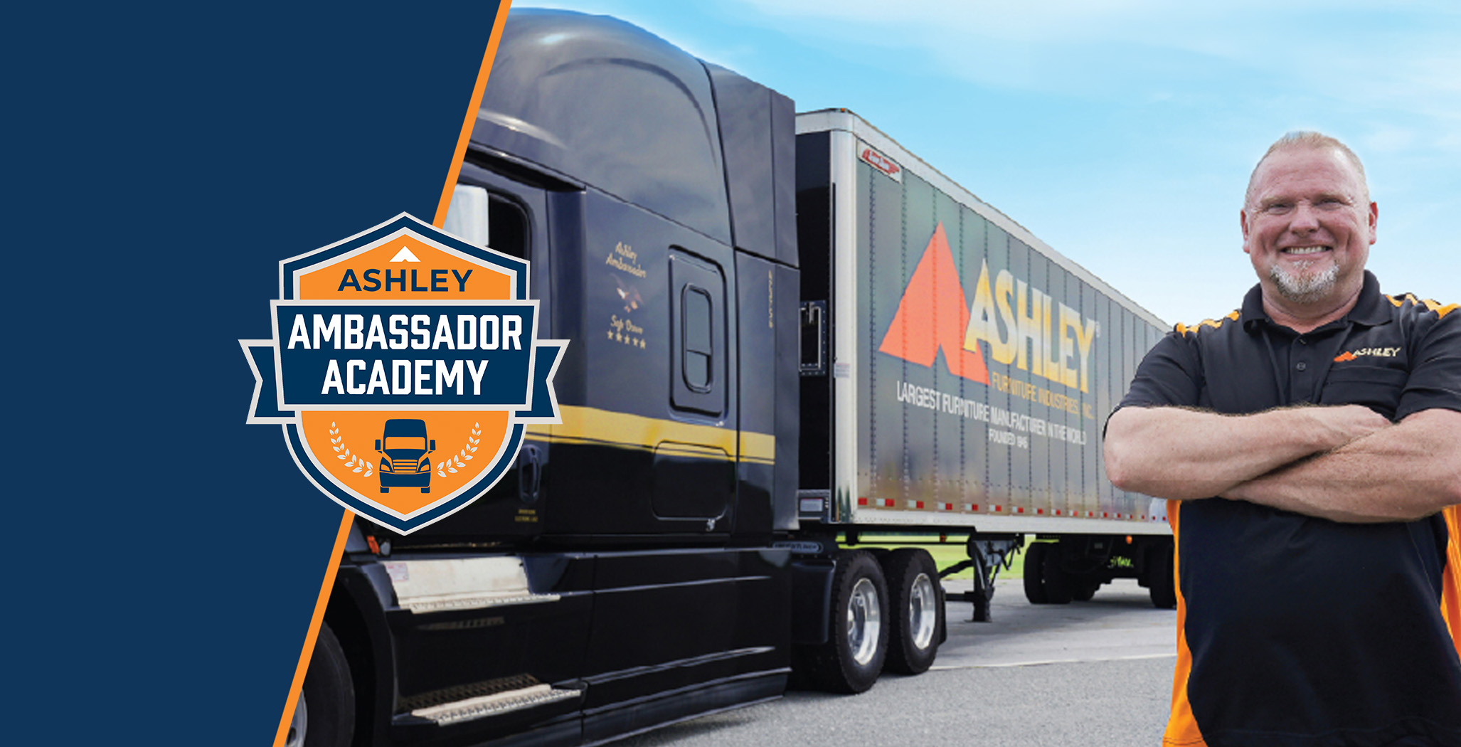 Ashley driver smiling and crossing his arms next to an Ashley Semitruck