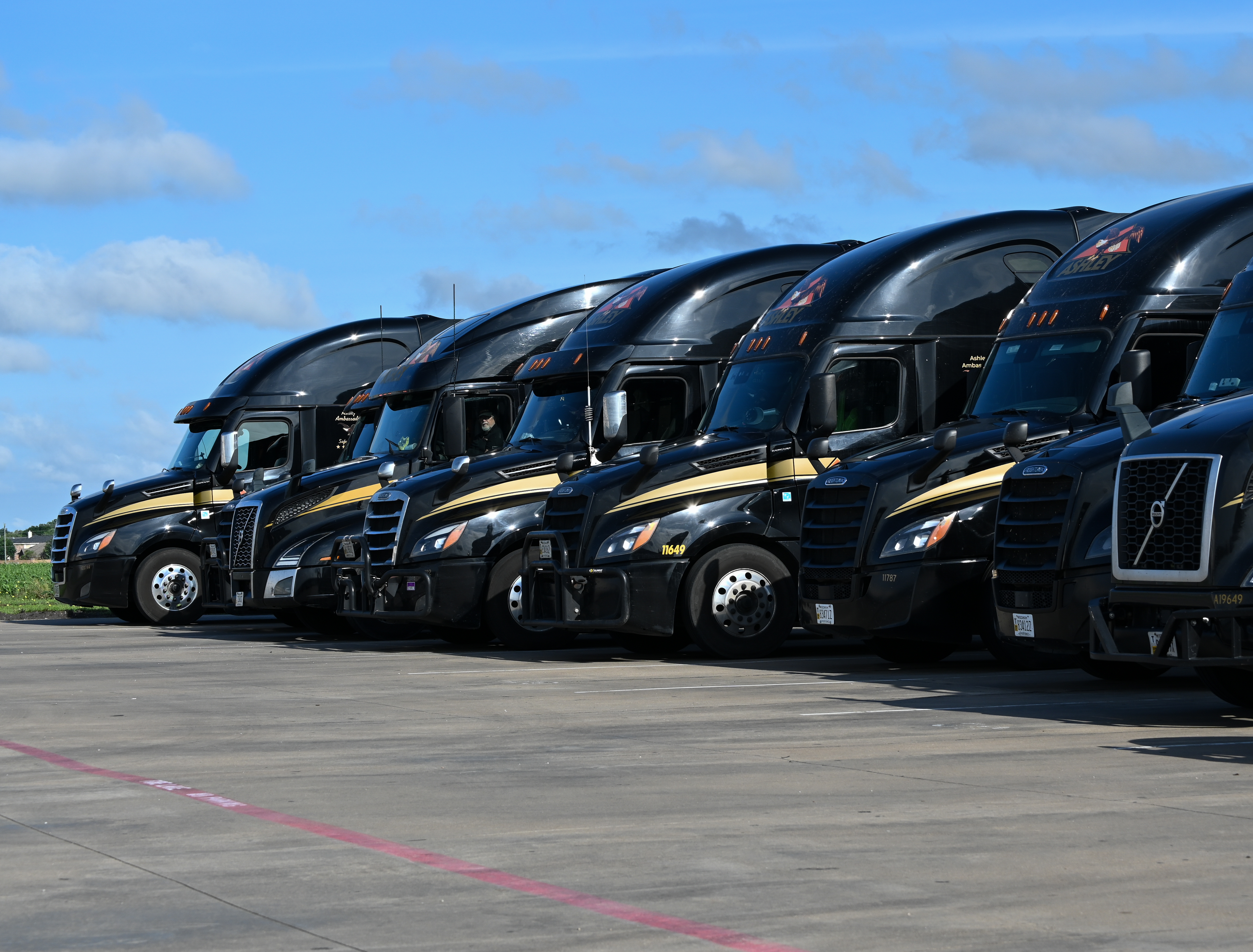 Ashley fleet of trucks parked.