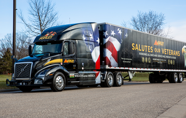 Ashley Truck with a veteran wrap on a road