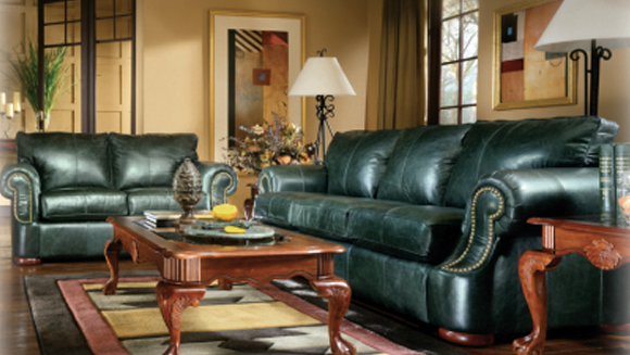 Green Ashley couches with a center middle table