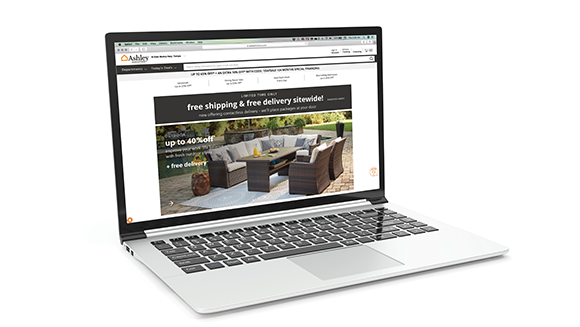 Laptop with Ashley website on screen