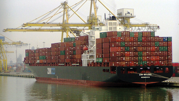 Boat with containers in a harbor